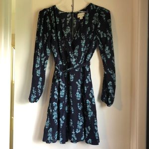 Short flowy dress with long sleeves.